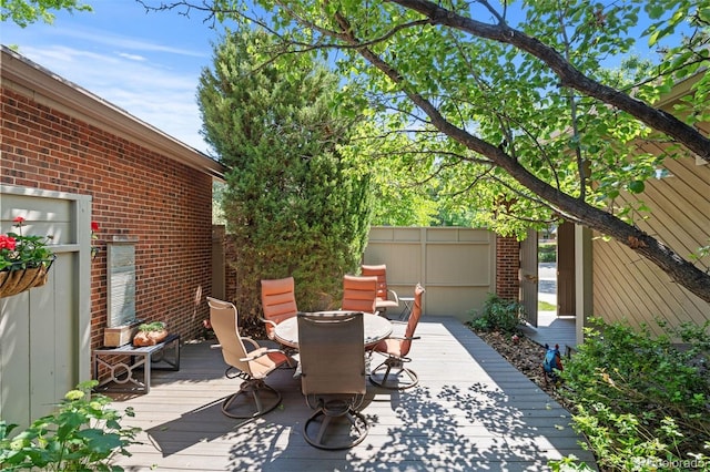 2601 S Quebec St Unit 11, Denver, CO 80231 - view of patio featuring a deck and outdoor dining area
