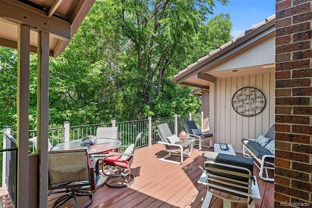 2601 S Quebec St Unit 11, Denver, CO 80231 - wooden terrace with outdoor dining area