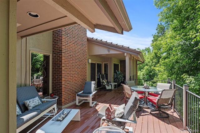 2601 S Quebec St Unit 11, Denver, CO 80231 - wooden terrace with outdoor dining space