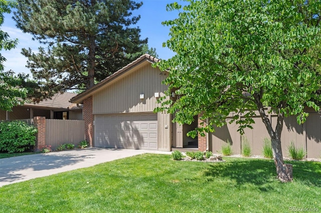 2601 S Quebec St Unit 11, Denver, CO 80231 - view of front of home featuring concrete driveway, brick siding, and an attached garage