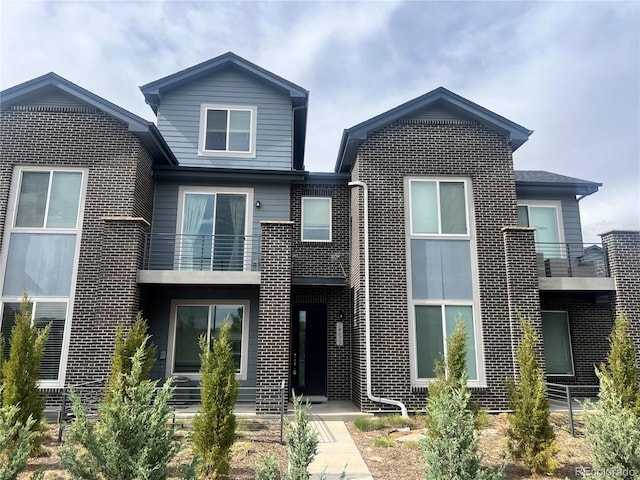 14673 E Belleview Dr, Aurora, CO 80015 - view of front of home with a balcony and brick siding