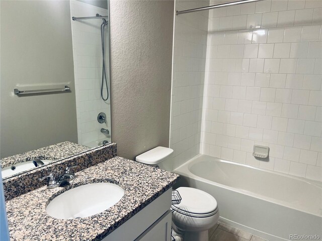 14673 E Belleview Dr, Aurora, CO 80015 - bathroom with a textured wall, vanity, toilet, and shower / bathtub combination