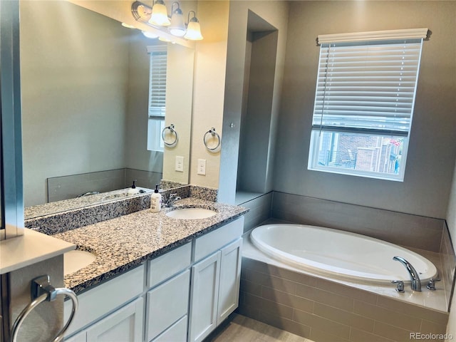 14673 E Belleview Dr, Aurora, CO 80015 - bathroom with a garden tub and double vanity