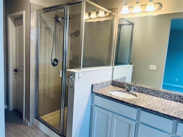 14673 E Belleview Dr, Aurora, CO 80015 - bathroom featuring a stall shower and vanity