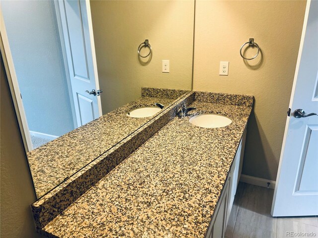 14673 E Belleview Dr, Aurora, CO 80015 - bathroom featuring vanity and baseboards
