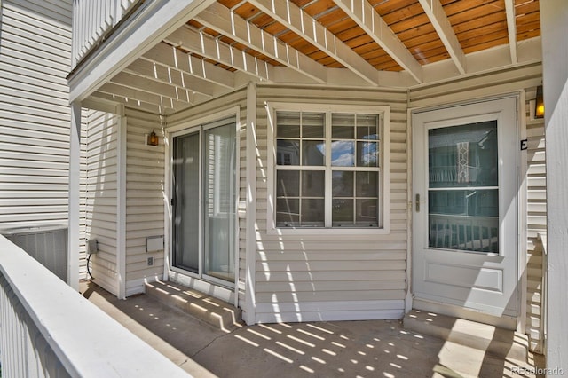 view of exterior entry featuring central air condition unit