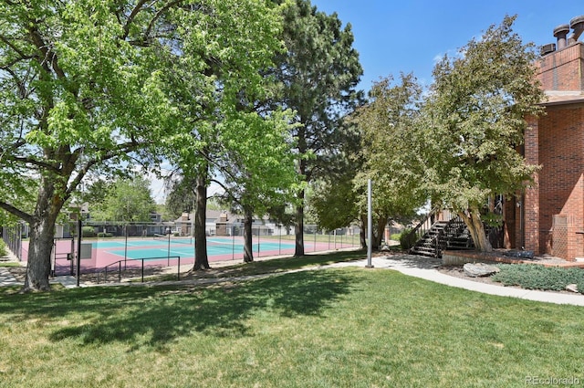 view of sport court featuring stairway