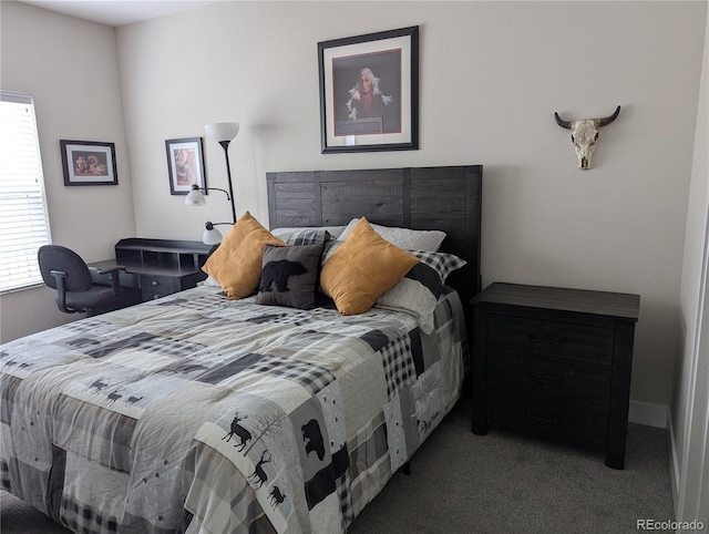 carpeted bedroom featuring multiple windows
