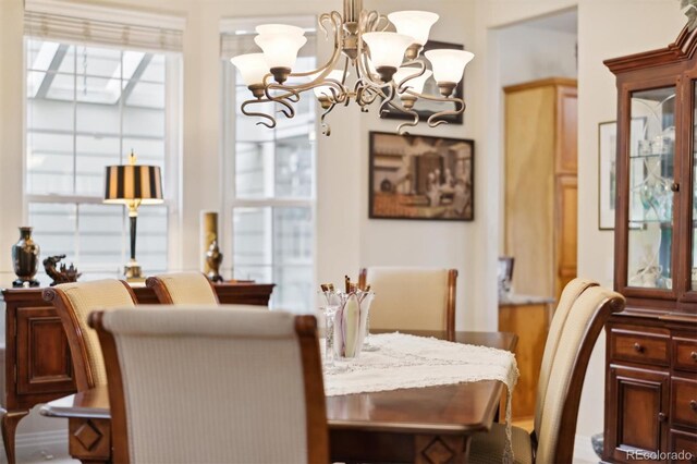 24422 E Frost Dr, Aurora, CO 80016 - dining room featuring a chandelier