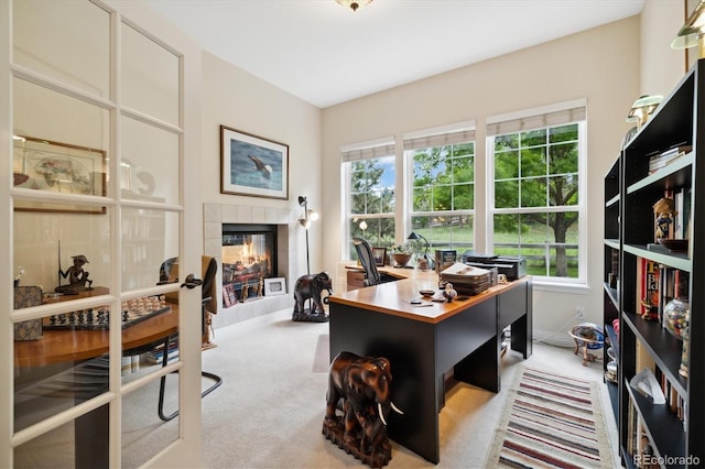 24422 E Frost Dr, Aurora, CO 80016 - office area featuring light carpet and a tiled fireplace