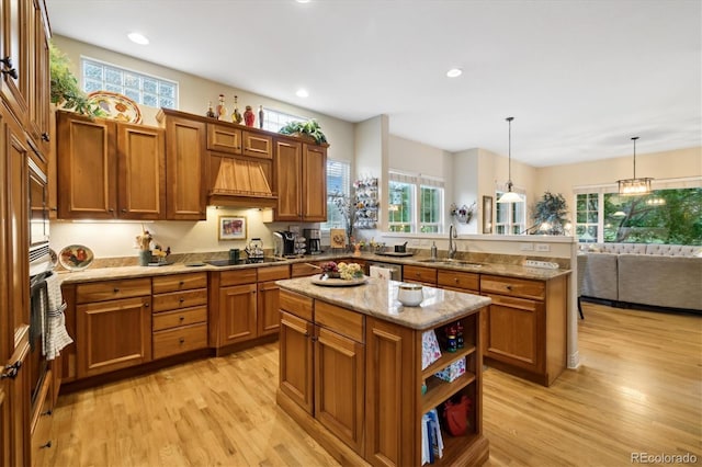 24422 E Frost Dr, Aurora, CO 80016 - kitchen with premium range hood, a peninsula, brown cabinetry, and recessed lighting