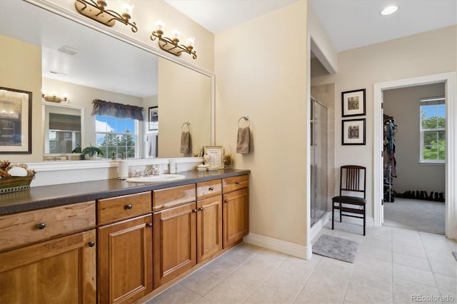 24422 E Frost Dr, Aurora, CO 80016 - full bath with vanity, a stall shower, healthy amount of natural light, and tile patterned flooring