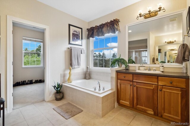 24422 E Frost Dr, Aurora, CO 80016 - full bath featuring vanity, plenty of natural light, a bath, and tile patterned flooring