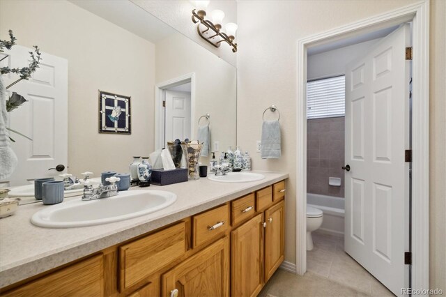 24422 E Frost Dr, Aurora, CO 80016 - bathroom featuring double vanity and tile patterned flooring