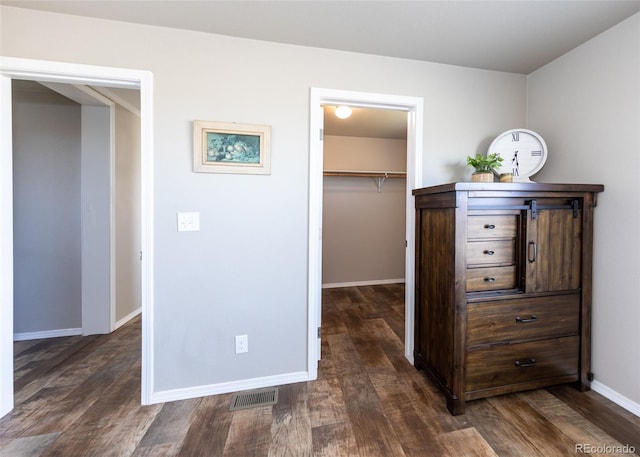 hall with dark hardwood / wood-style flooring