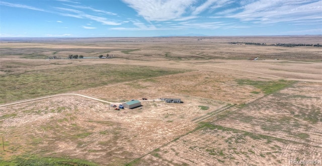 birds eye view of property with a rural view