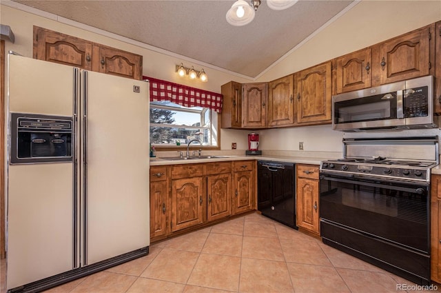 kitchen featuring vaulted ceiling, black appliances, sink, light tile floors, and ornamental molding