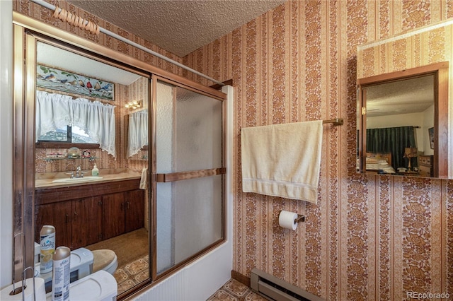 full bathroom with sink, toilet, bath / shower combo with glass door, and a textured ceiling