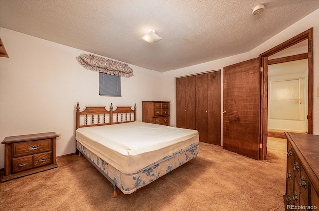 carpeted bedroom featuring a textured ceiling