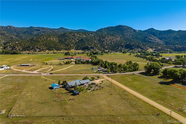 aerial view featuring a mountain view and a rural view