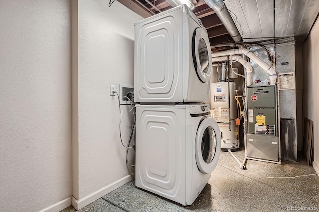 clothes washing area with stacked washer / dryer, water heater, heating unit, and baseboards