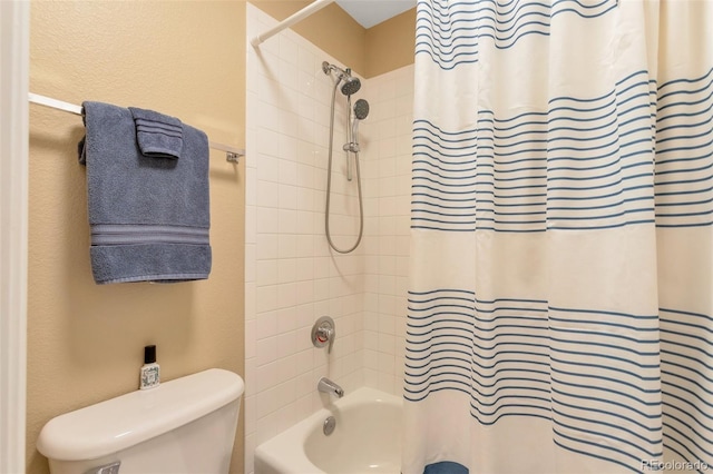 full bath featuring shower / bath combo and toilet