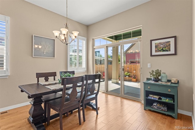 8272 E 55th Pl, Denver, CO 80238 - dining area with a chandelier and light wood finished floors
