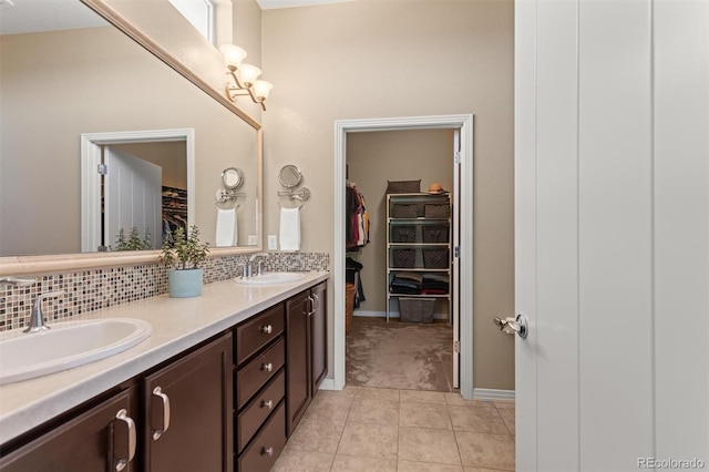 8272 E 55th Pl, Denver, CO 80238 - full bath featuring double vanity, a walk in closet, and tasteful backsplash