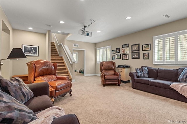 8272 E 55th Pl, Denver, CO 80238 - living room with light colored carpet, stairway, and recessed lighting