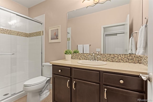 8272 E 55th Pl, Denver, CO 80238 - full bathroom with backsplash, a stall shower, vanity, and tile patterned flooring