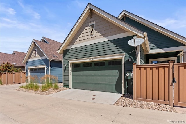 8272 E 55th Pl, Denver, CO 80238 - view of front of house featuring concrete driveway and a gate