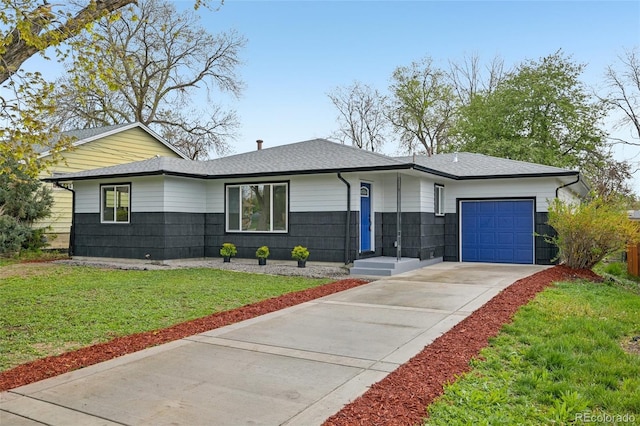 single story home featuring an attached garage, a shingled roof, driveway, and a front yard