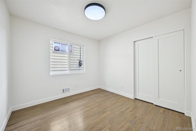 7780 Osceola St, Westminster, CO 80030 - unfurnished bedroom featuring wood finished floors and a closet