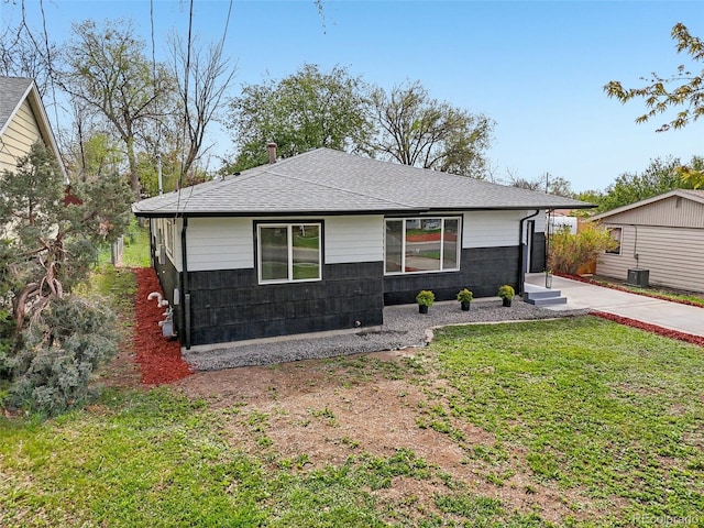 7780 Osceola St, Westminster, CO 80030 - view of front facade with a shingled roof and a front yard