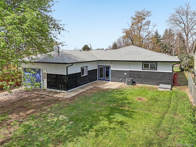 7780 Osceola St, Westminster, CO 80030 - rear view of property with a shingled roof and a garage