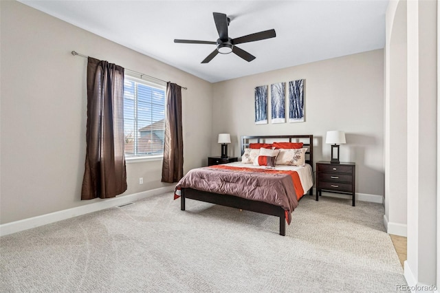 bedroom featuring ceiling fan and light carpet