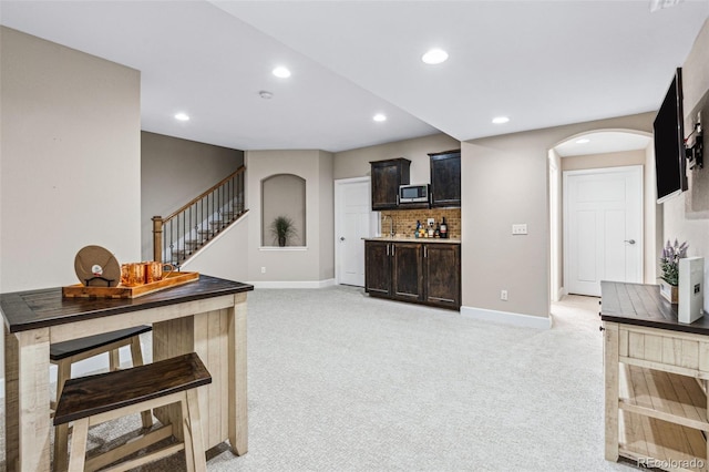 living room featuring light carpet