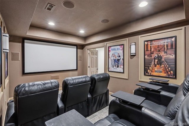 home theater room with a textured ceiling