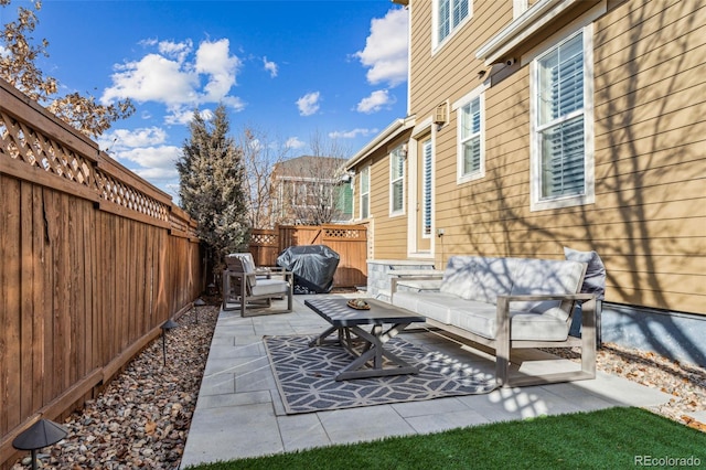 view of patio with a grill and an outdoor hangout area