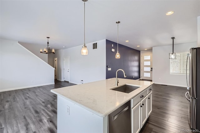 kitchen featuring a sink, appliances with stainless steel finishes, dark wood finished floors, and recessed lighting