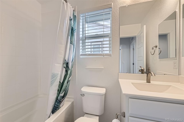 bathroom featuring vanity, toilet, and shower / bath combo with shower curtain