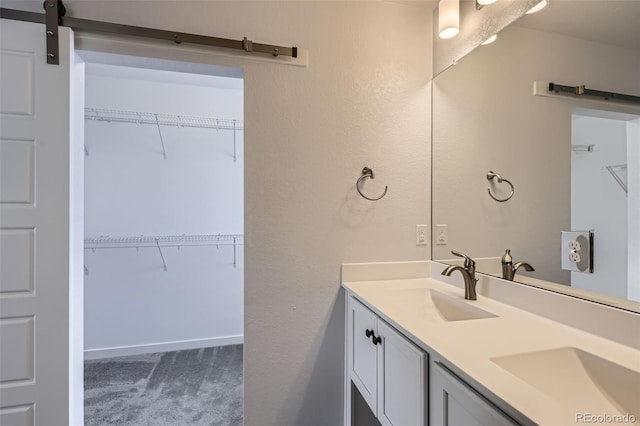 full bathroom with double vanity and a sink