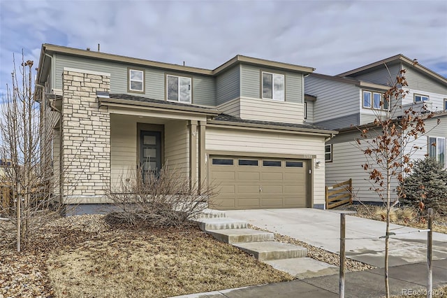 traditional home featuring an attached garage and driveway