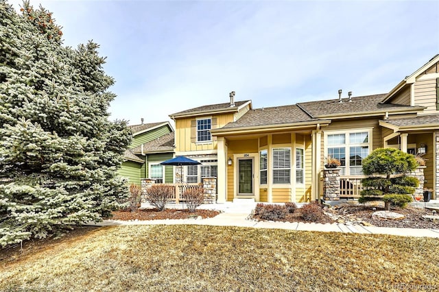 view of front of house with board and batten siding and stone siding