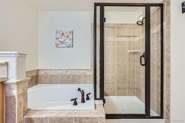 full bath featuring a garden tub and a stall shower