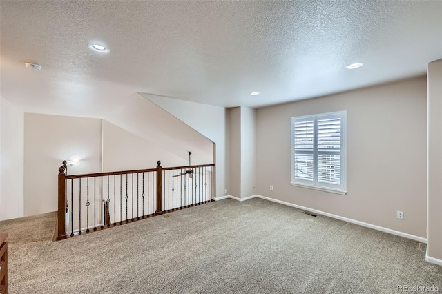 1104 Rumbling Sky Pl, Castle Rock, CO 80108 - empty room featuring a textured ceiling, carpet flooring, a smoke detector, and recessed lighting