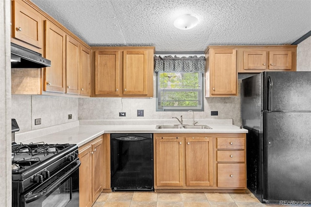 715 E Chester St, Lafayette, CO 80026 - kitchen with black appliances, under cabinet range hood, light countertops, and a textured ceiling