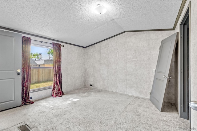 715 E Chester St, Lafayette, CO 80026 - carpeted empty room with vaulted ceiling, a textured ceiling, and crown molding