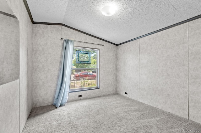 715 E Chester St, Lafayette, CO 80026 - carpeted empty room with vaulted ceiling, a textured ceiling, and crown molding