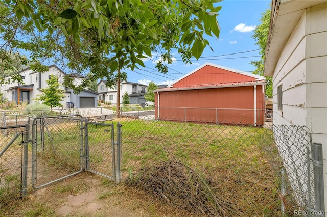715 E Chester St, Lafayette, CO 80026 - view of yard with a gate and a garage
